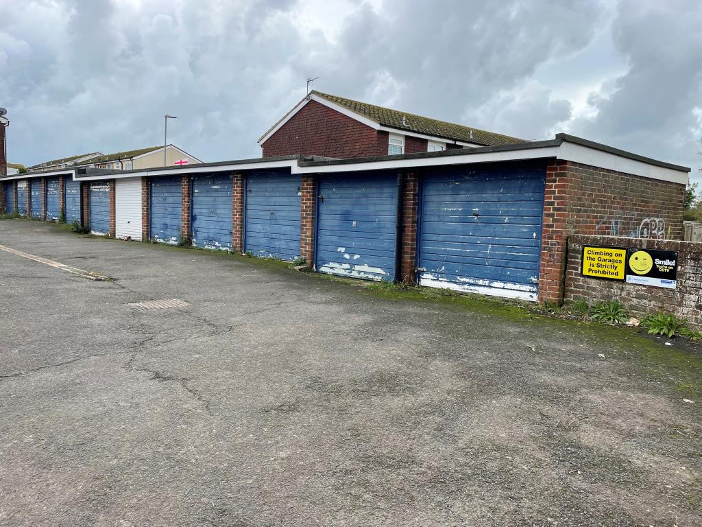 Lot: 98 - TWENTY-TWO LOCK-UP GARAGES IN A COMPOUND - Western block of twelve garages